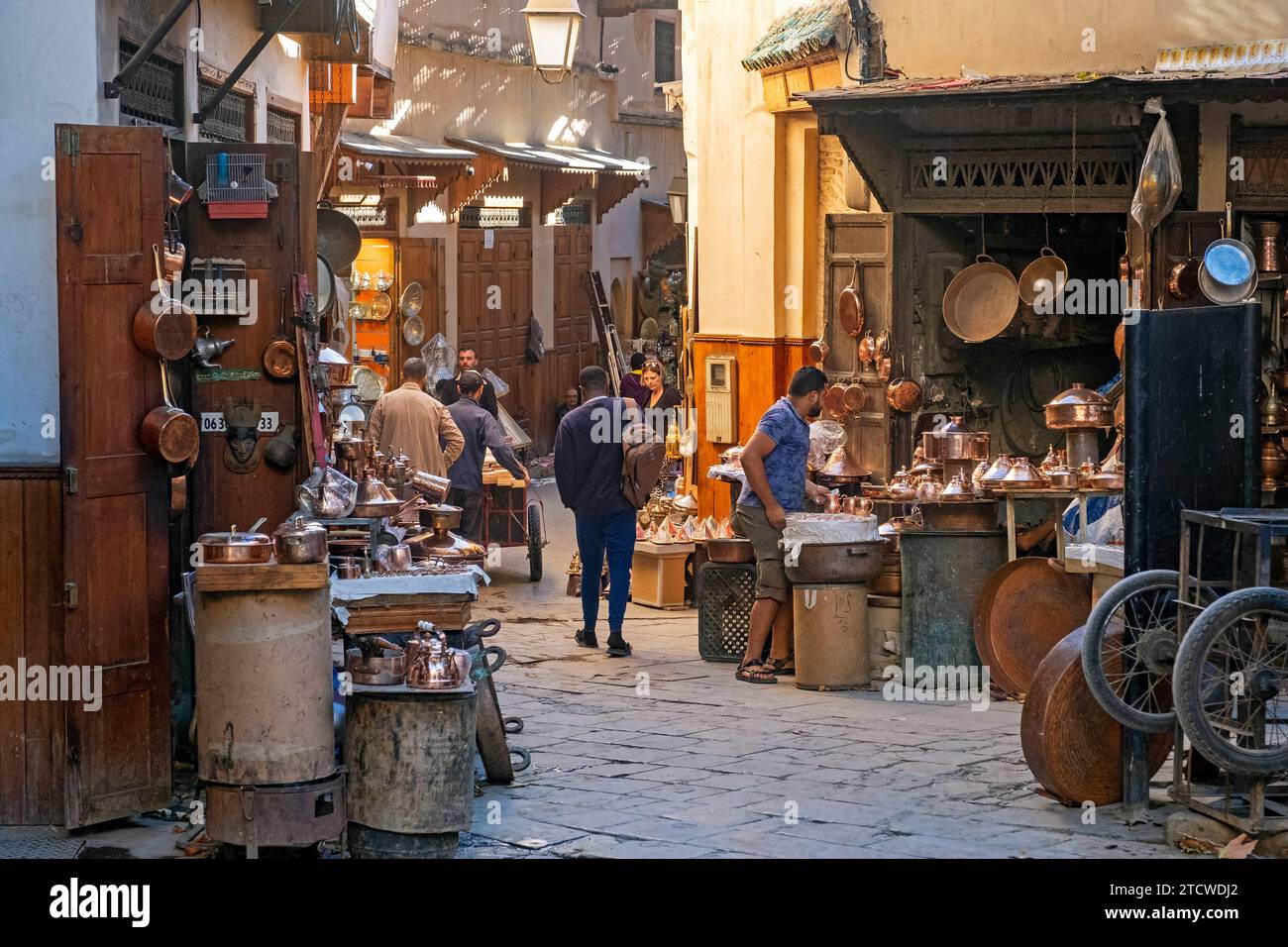 Moroccan coppersmiths’ workshops and shops on Place Seffarine, small square in medina of the city Fes / Fez, Fez-Meknes, Morocco Stock Photo