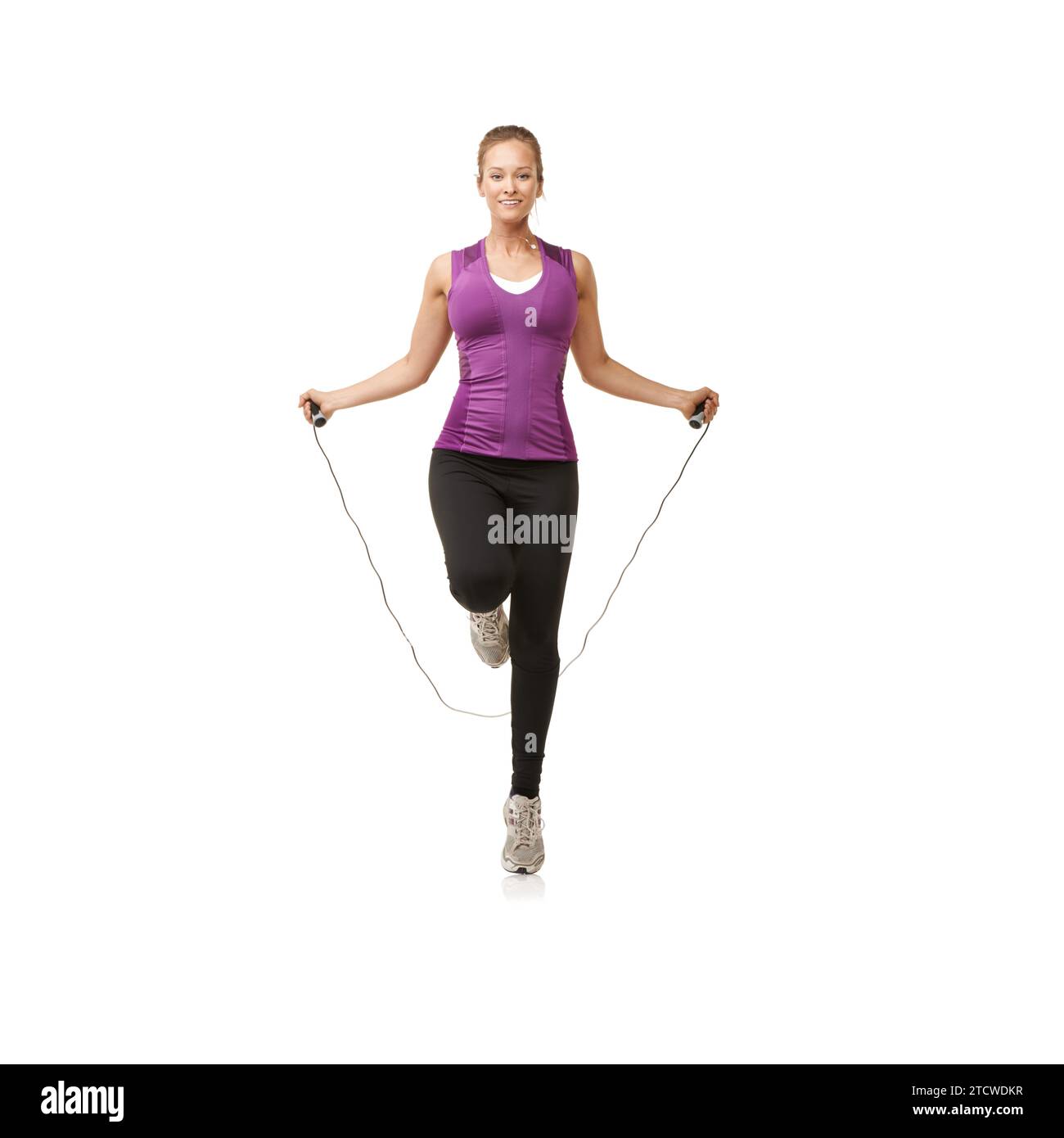 Portrait, skipping rope and woman on a white background for cardio ...