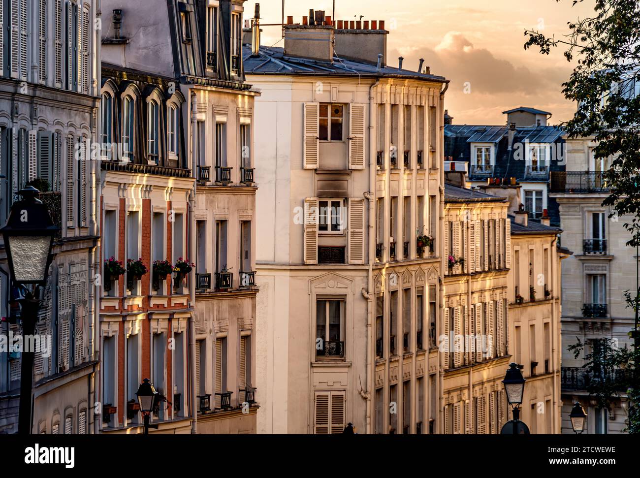 The apartments and buildings of Rue le Pic , a street in Montmartre in the late afternoon winter sunshine in the 18th arrondissement of Paris, France Stock Photo