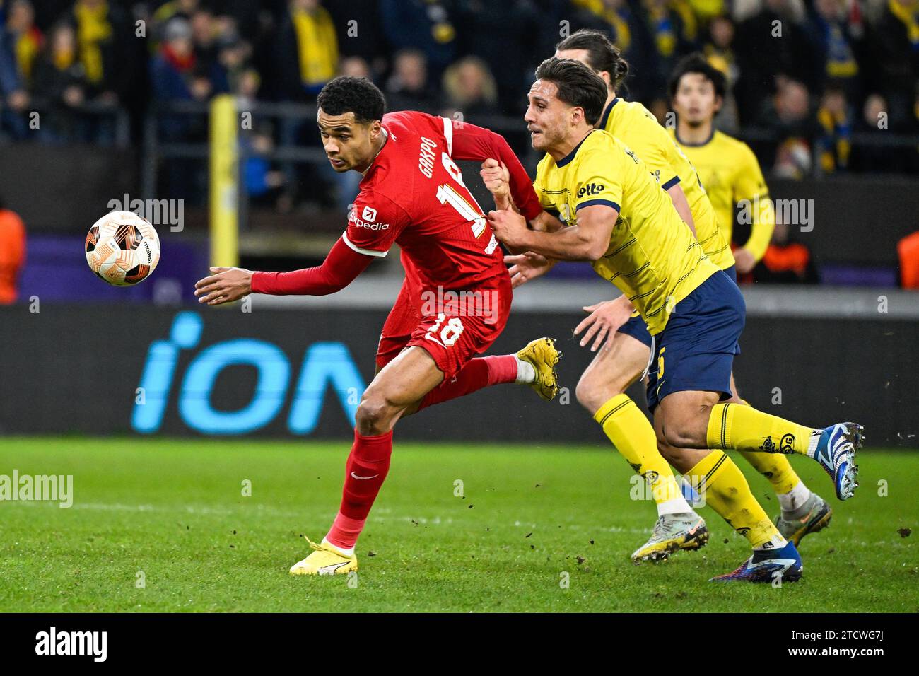 Brussels, Belgium. 14th Dec, 2023. Liverpool's Cody Gakpo and Union's Kevin Mac Allister fight for the ball during a game between Belgian soccer team Royale Union Saint Gilloise and English club Liverpool FC, on Thursday 14 December 2023 in Brussels, on the sixth and last day of the group phase of the UEFA Europa League competition, in group E. BELGA PHOTO LAURIE DIEFFEMBACQ Credit: Belga News Agency/Alamy Live News Stock Photo