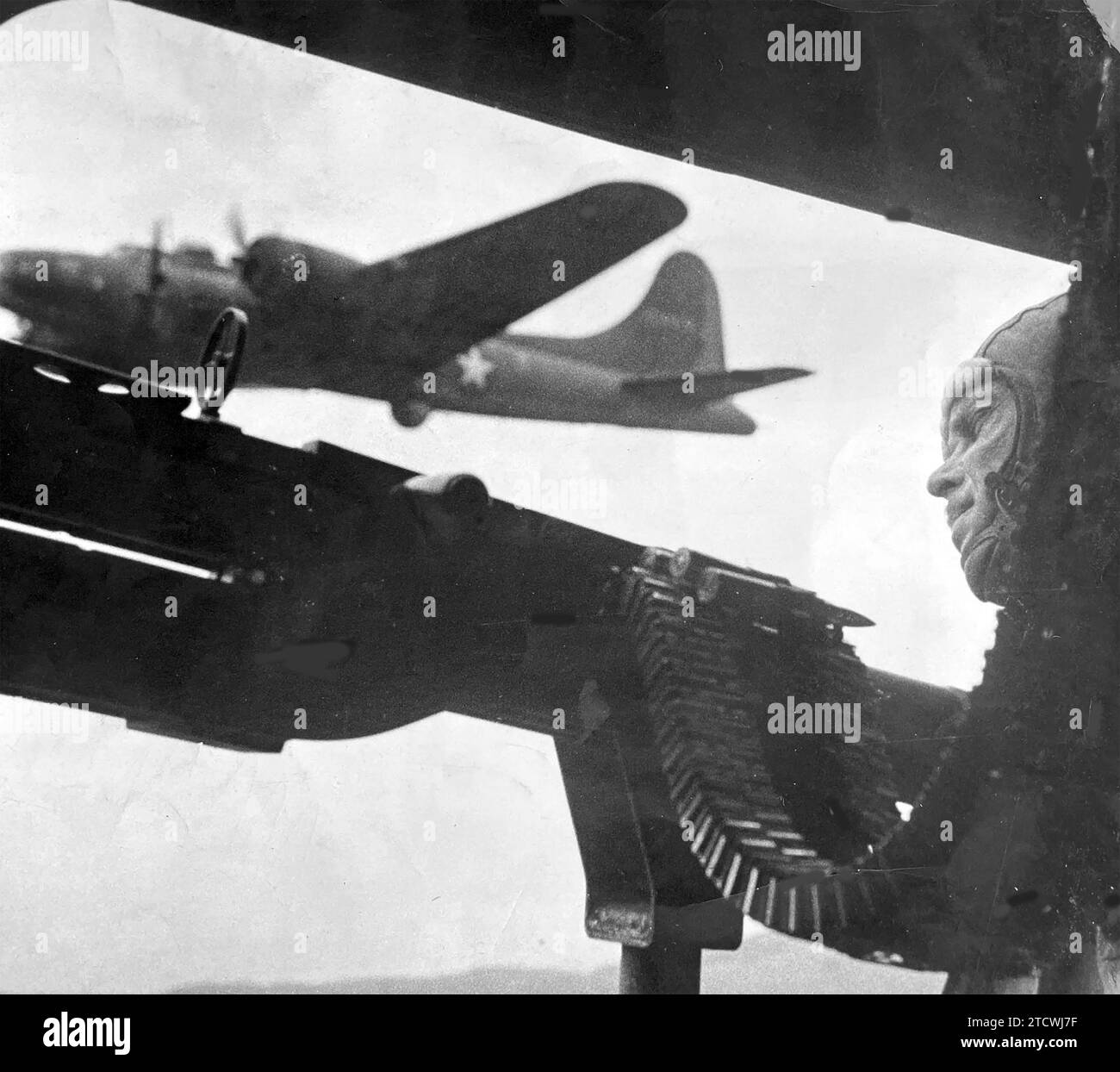 B-17 Flying Fortress waist gunner of the USAAF on a raid from north Africa to Italy in 1943 prior to the invasion of Operation Husky Stock Photo