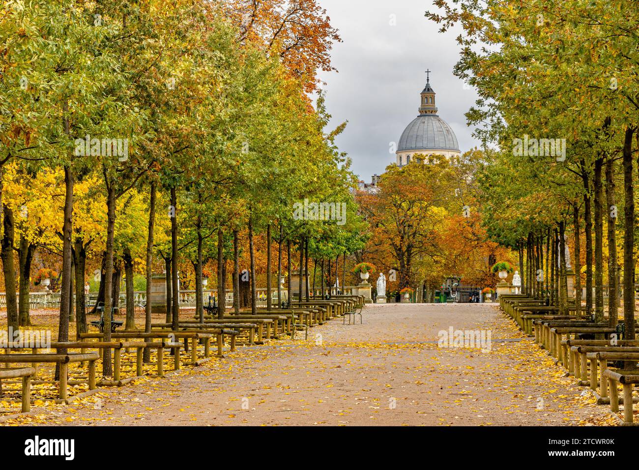 A tree lined avenue at autumn at The Jardin du Luxembourg with the dome of the Panthéon in the background, Paris,France Stock Photo