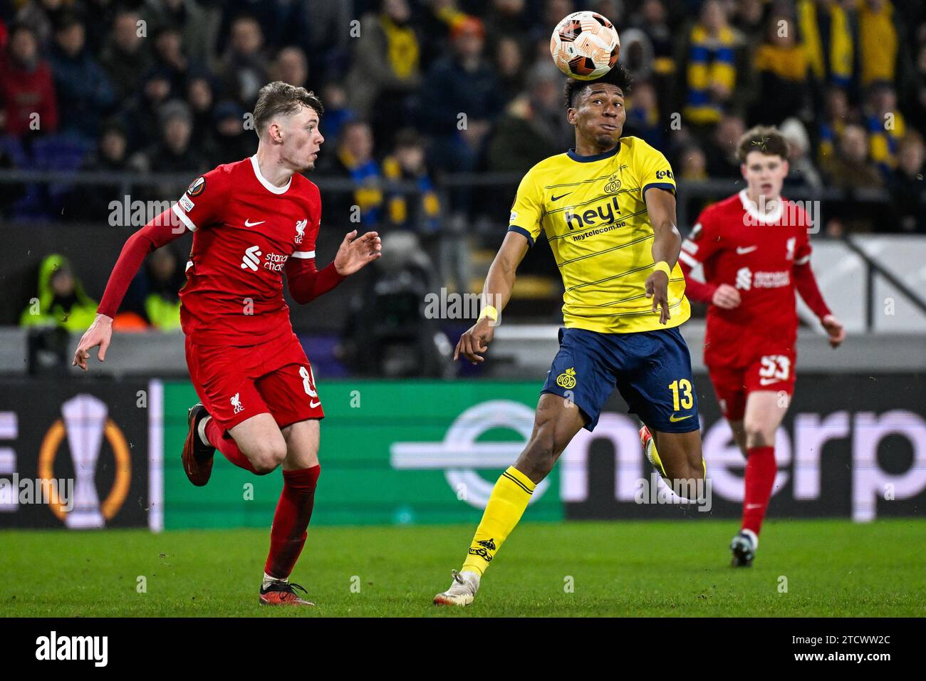 Brussels, Belgium. 14th Dec, 2023. Liverpool's Conor Bradley and Union's Kevin Rodriguez fight for the ball during a game between Belgian soccer team Royale Union Saint Gilloise and English club Liverpool FC, on Thursday 14 December 2023 in Brussels, on the sixth and last day of the group phase of the UEFA Europa League competition, in group E. BELGA PHOTO LAURIE DIEFFEMBACQ Credit: Belga News Agency/Alamy Live News Stock Photo