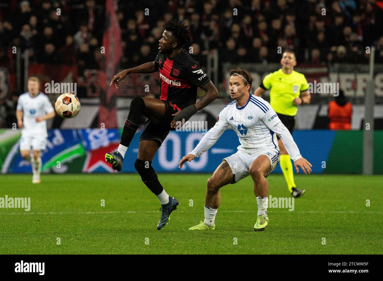 Leverkusen, Deutschland. 14th Dec, 2023. 14.12.2023, BayArena, Leverkusen, GER, UEFA Europa League 6 Spieltag, Bayer 04 Leverkusen vs Molde Fotballklubb Im Bild: Edmond Tapsoba (Bayer 04 Leverkusen, #12) Ballannahme Foto © nordphoto GmbH/Christian Schulze Credit: dpa/Alamy Live News Stock Photo