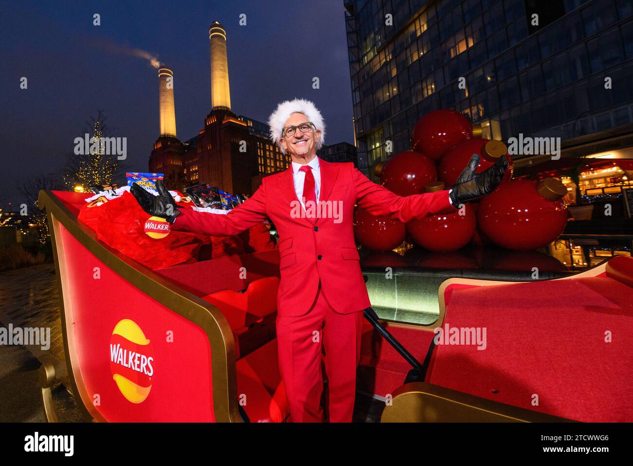 EDITORIAL USE ONLY Gary Lineker surprises members of the public by driving a sleigh full of Walkers crisps around Battersea Power Station, south London, while dressed as 'Father Crisp-mas' to mark his 30th year working with the brand. Picture date: Thursday December 14, 2023. Stock Photo