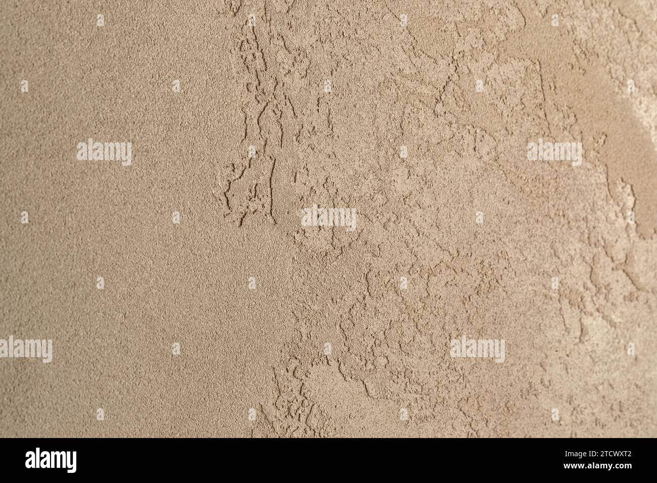 Clay wall close up with beautiful textures in earthy sandy shades. Wabi-sabi interior textures Stock Photo