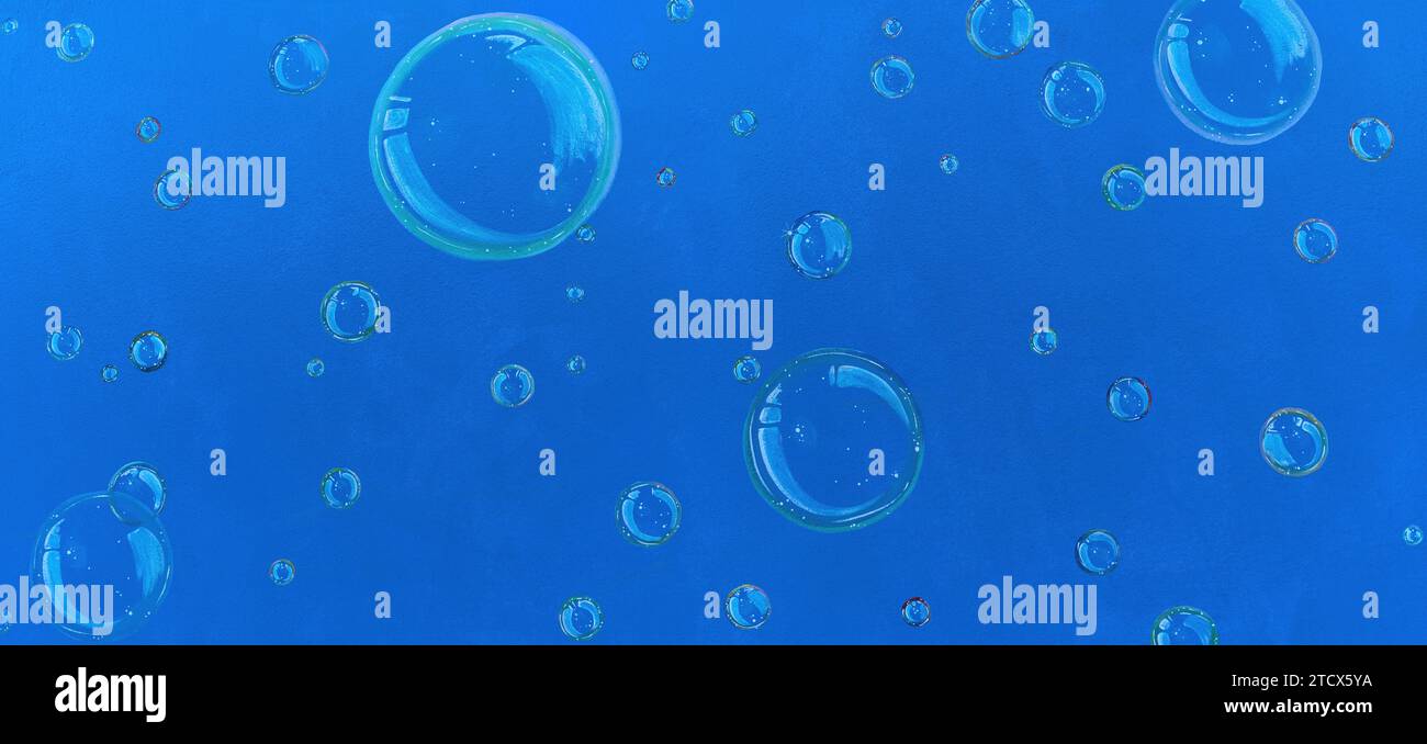 Painted soap bubbles on a blue wall Stock Photo