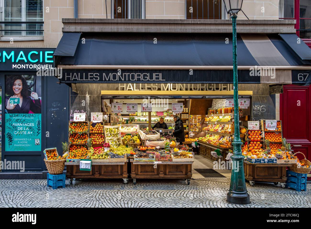 People shopping at Halles Montorgueil , a fruit and vegetable shop on Rue Montorgueil,Paris, France Stock Photo