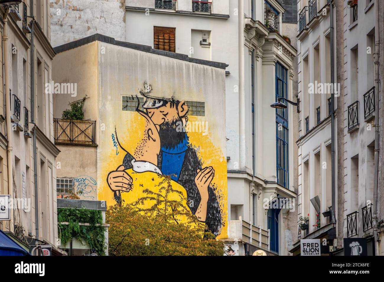 Street art  on a building of Tintin and Captain Haddock Kissing ,on Rue des Petits Carreaux ,Paris,France Stock Photo