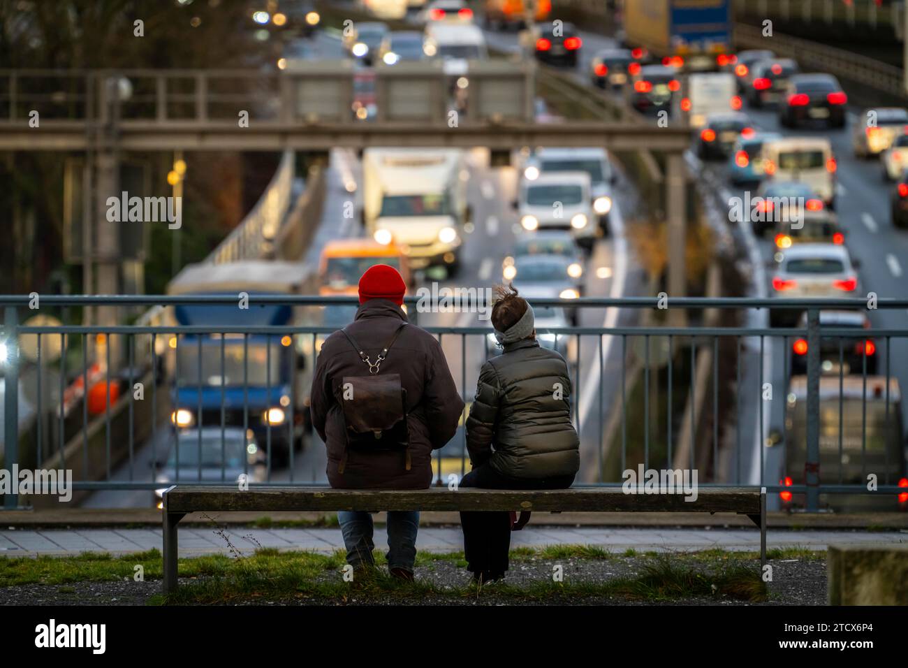 Traffic jam on the A40 motorway, city passage, Essen-Huttrop junction, traffic jam in both directions, 2 people looking at the traffic jam, at the Ruh Stock Photo