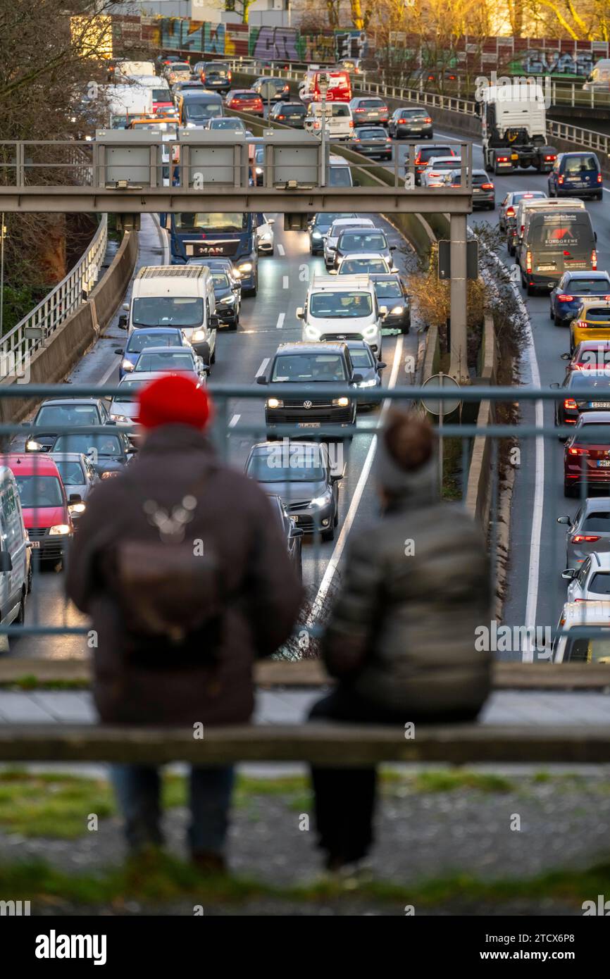 Traffic jam on the A40 motorway, city passage, Essen-Huttrop junction, traffic jam in both directions, 2 people looking at the traffic jam, at the Ruh Stock Photo