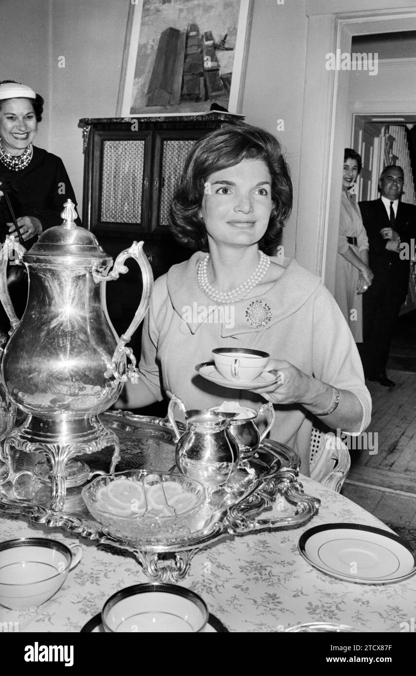 Jacqueline Kennedy, wife of U.S. presidential candidate Senator John F. Kennedy, seated at table with tea service, during tea for women journalists, Warren K. Leffler, U.S. News & World Report Magazine Photograph Collection, October 5, 1960 Stock Photo