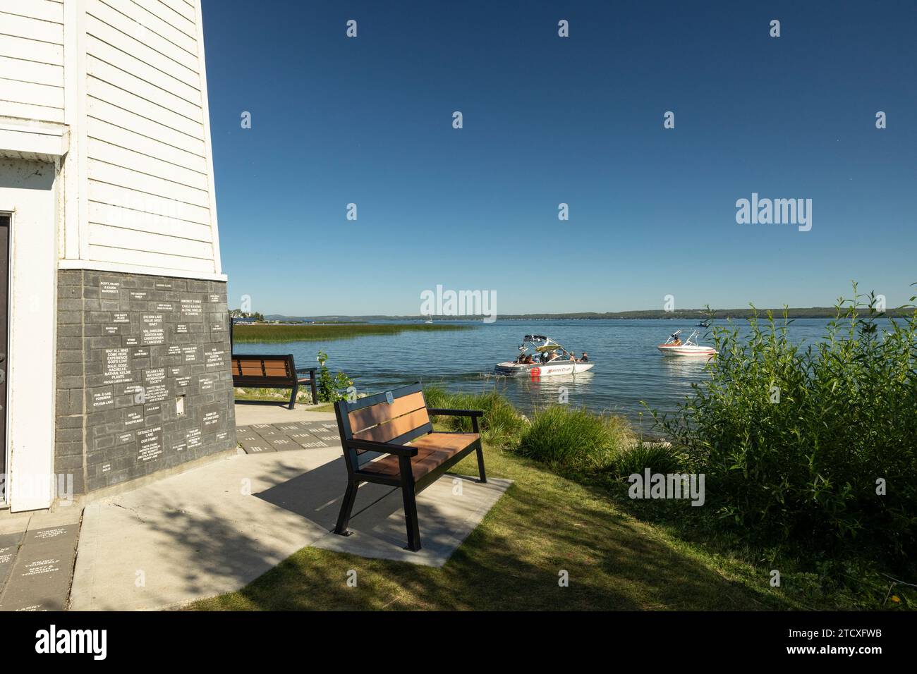 Sylvan Lake, AB, Canada - View of lake from beside replica of famous Peggy's Cove lighthouse Stock Photo