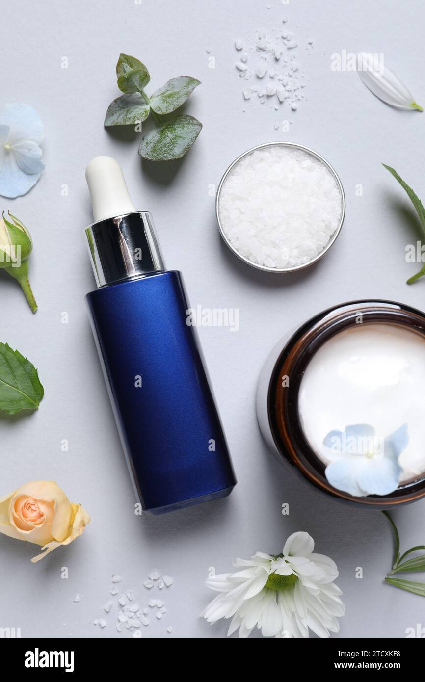 Flat lay composition with cosmetic serum on light grey background Stock ...
