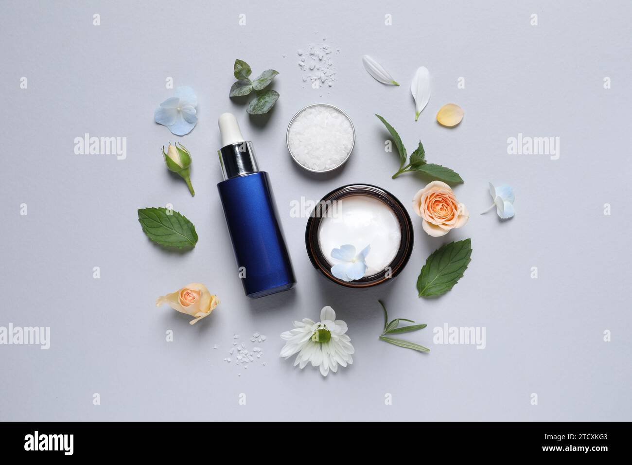 Flat lay composition with cosmetic serum on light grey background Stock ...