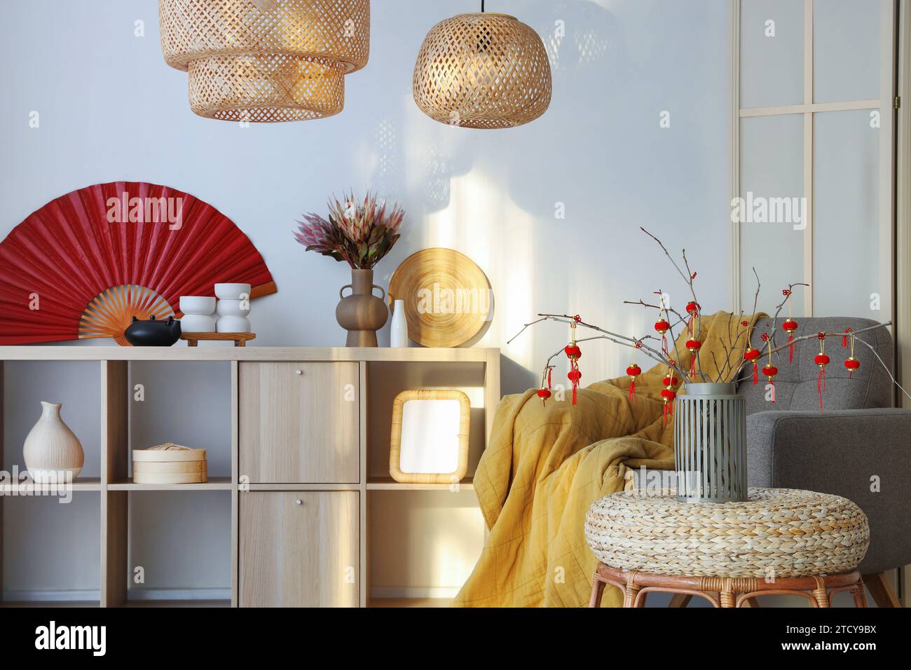 Interior of light living room with grey armchair and traditional ...