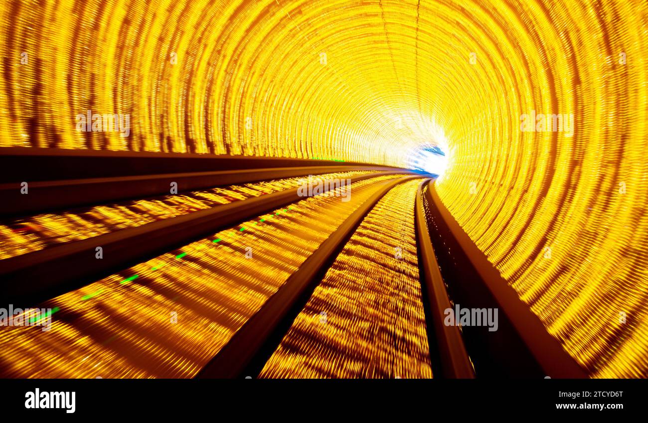 Train moving fast in tunnel with blurred motion Stock Photo - Alamy