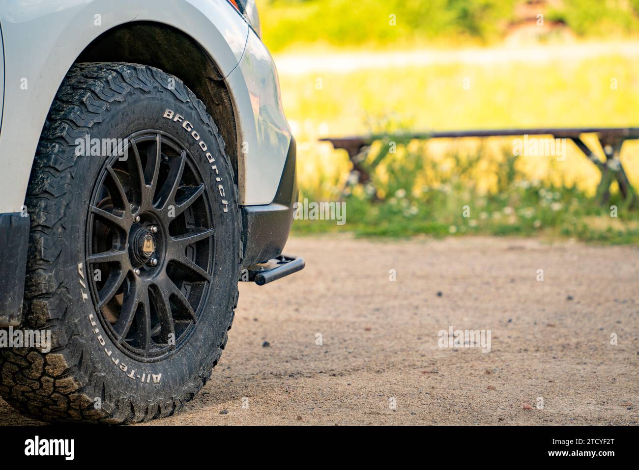 Close-up of a rugged off-road tire on a vehicle in a Grand Lake, Colorado parking lot. Stock Photo