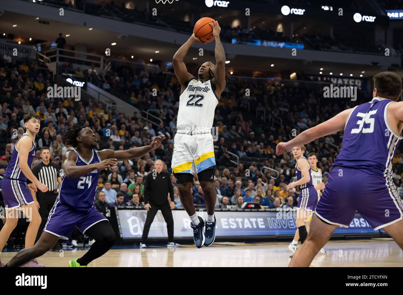December 14, 2023 Marquette Golden Eagles guard Sean Jones (22) shoots a layup in front of St