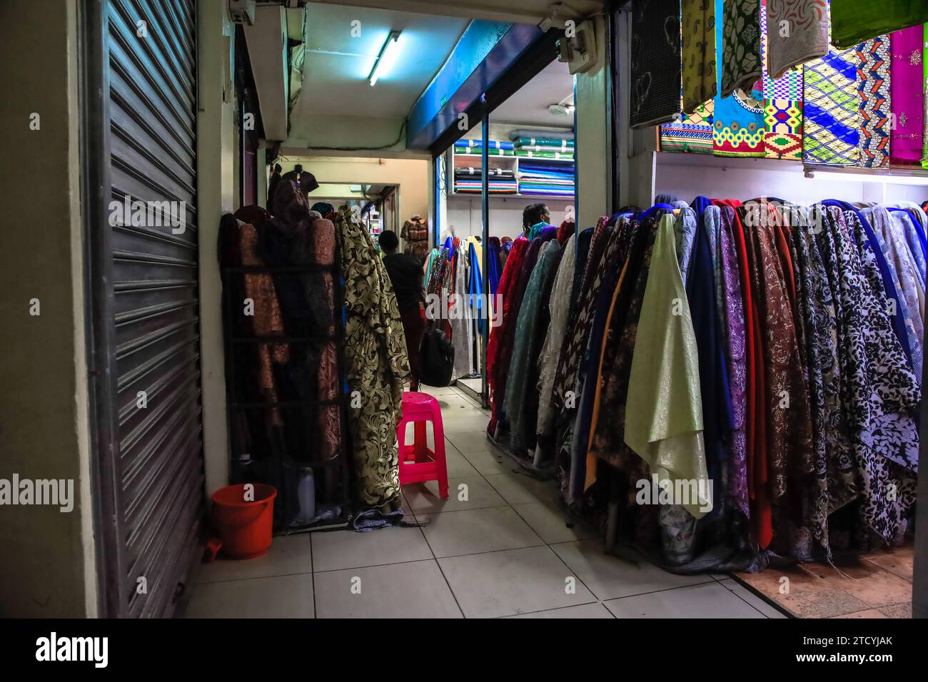 Shop Na Robi Consumers are checking on fabric products at a textile shop in Biashara ...