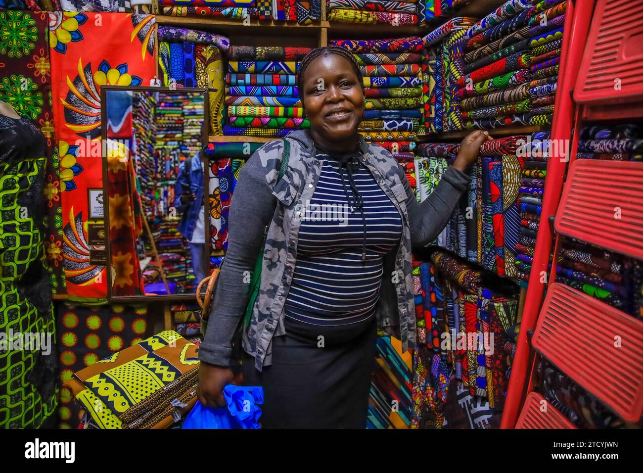 Tabitha Achieng, a tailor from Kibera Slum is buying her fabric