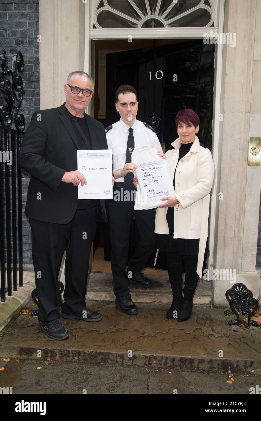 Sean Kennedy, Dr Anna Kennedy OBE and her team hand in a petition at