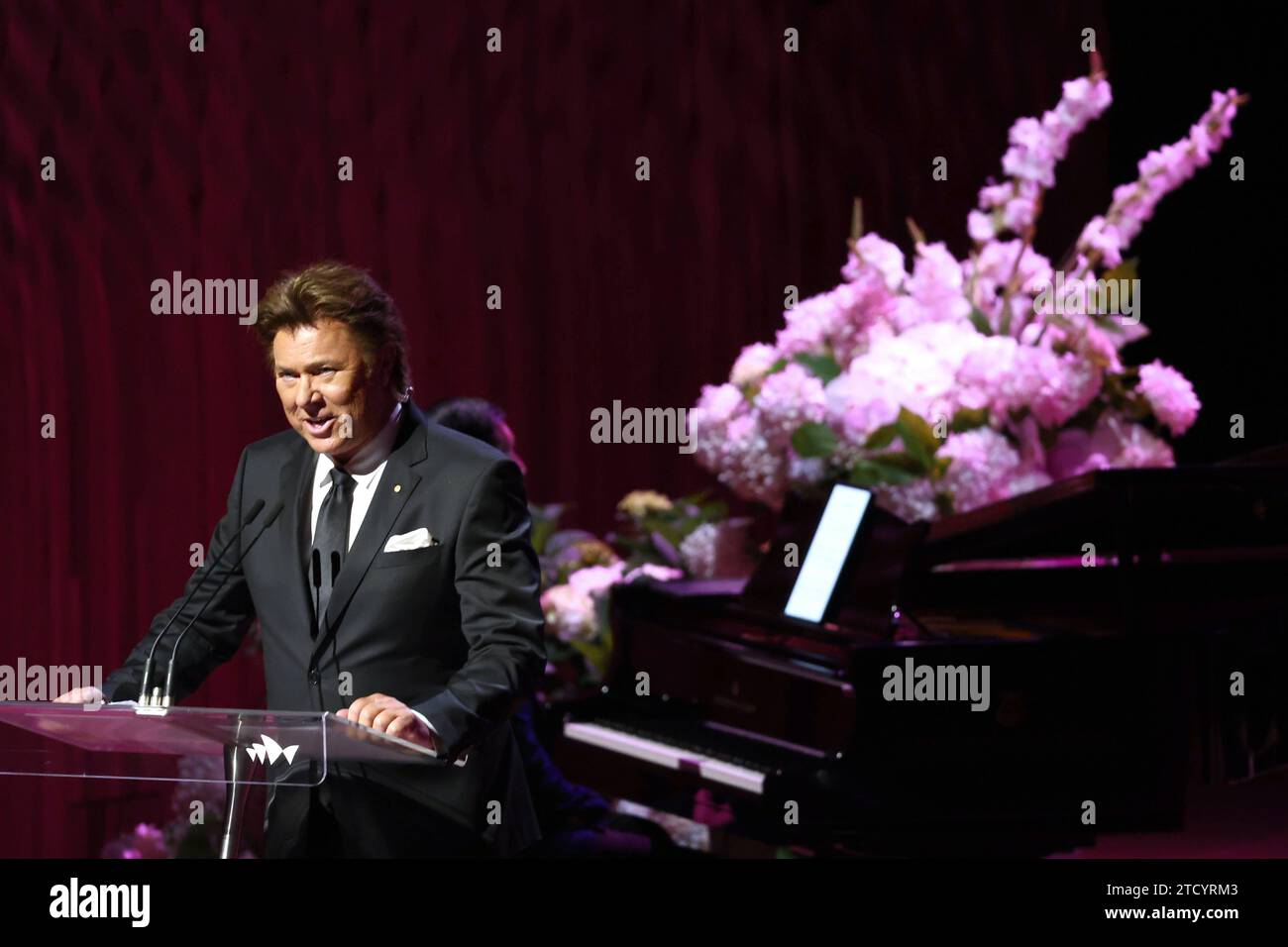 Richard Wilkins speaks during the State Memorial Service for Australian comedian and actor Barry Humphries at the Sydney Opera House in Sydney, Friday, December 15, 2023. A State Memorial Service for Barry Humphries will recognise the late entertainers contribution to Australian arts and entertainment. AAP Image/Pool, David Gray NO ARCHIVING SYDNEY NSW AUSTRALIA *** Richard Wilkins speaks during the State Memorial Service for Australian comedian and actor Barry Humphries at the Sydney Opera House in Sydney, Friday, December 15, 2023 A State Memorial Service for Barry Humphries will recognize t Stock Photo