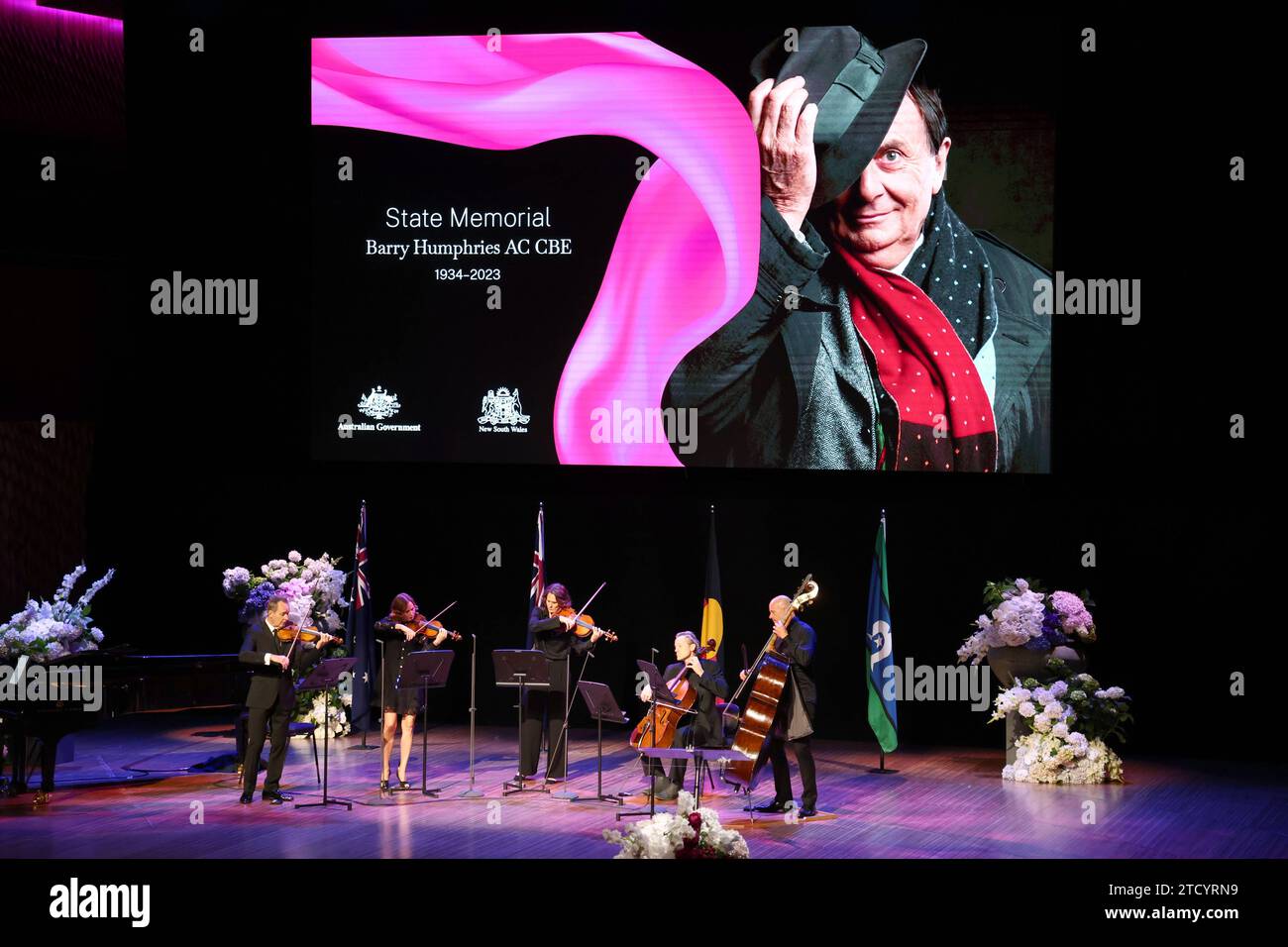 Members of the Australian Chamber Orchestra perform during the State Memorial Service for Australian comedian and actor Barry Humphries at the Sydney Opera House in Sydney, Friday, December 15, 2023. A State Memorial Service for Barry Humphries will recognise the late entertainers contribution to Australian arts and entertainment. AAP Image/Pool, David Gray NO ARCHIVING SYDNEY NSW AUSTRALIA *** Members of the Australian Chamber Orchestra perform during the State Memorial Service for Australian comedian and actor Barry Humphries at the Sydney Opera House in Sydney, Friday, December 15, 2023 A S Stock Photo