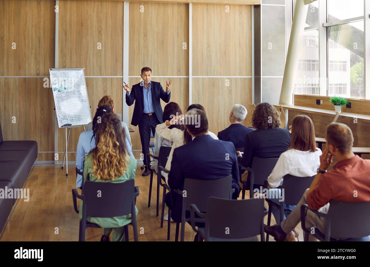 Business coach gives corporate presentation hi-res stock photography ...
