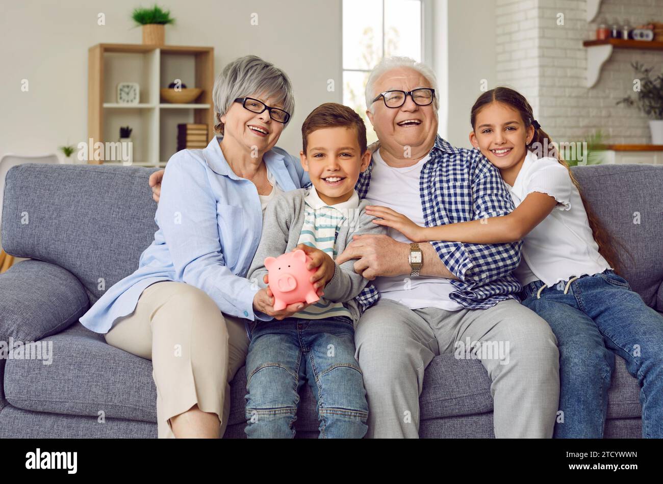 Grandchildren grandparents saving hires stock photography and images