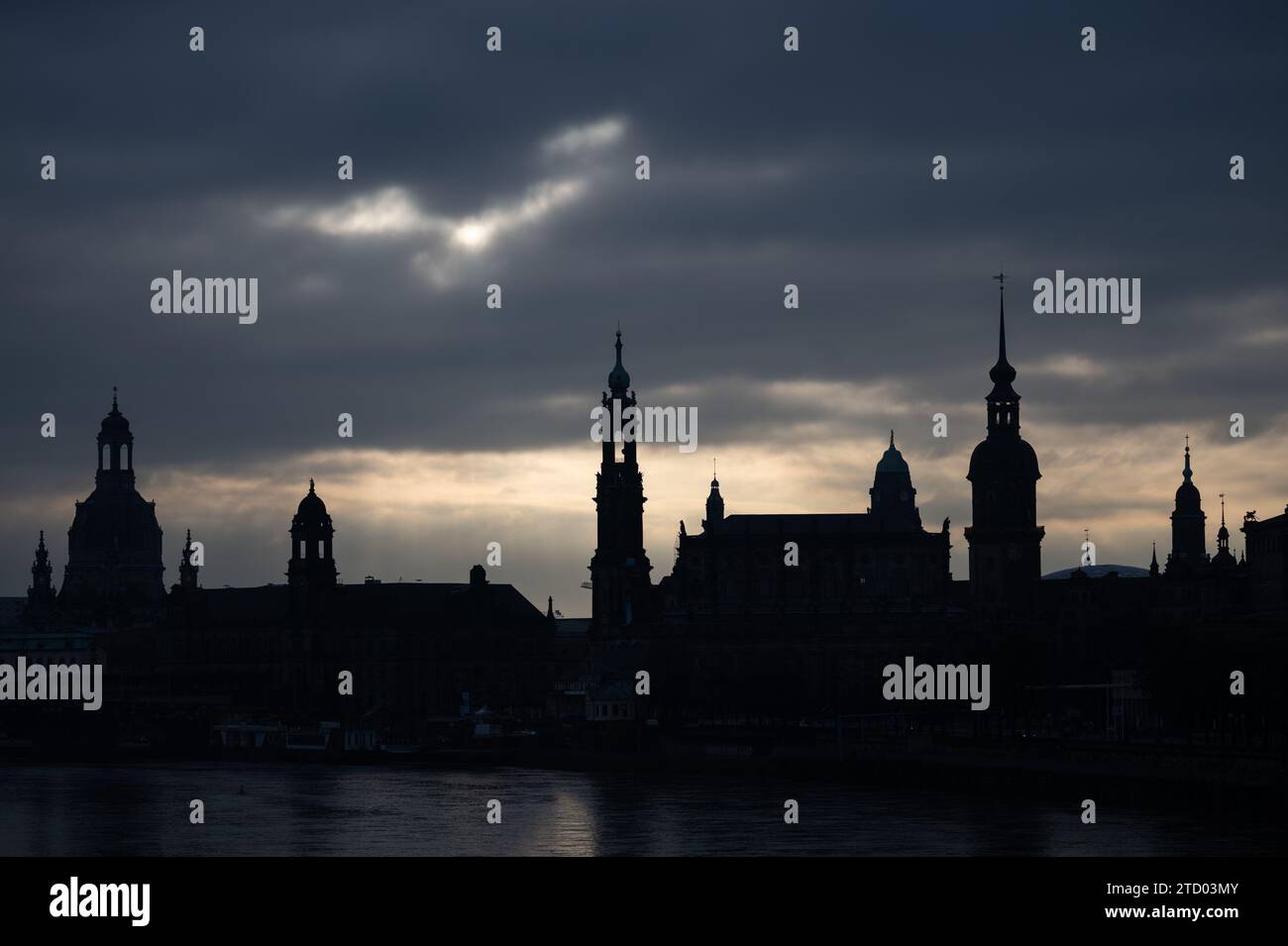 15 December 2023, Saxony, Dresden: The old town backdrop with the Frauenkirche (l-r), the Ständehaus, the Hofkirche, the town hall, the Hausmannsturm and the Kreuzkirche is silhouetted against dark clouds in the morning. Photo: Robert Michael/dpa Credit: dpa picture alliance/Alamy Live News Stock Photo