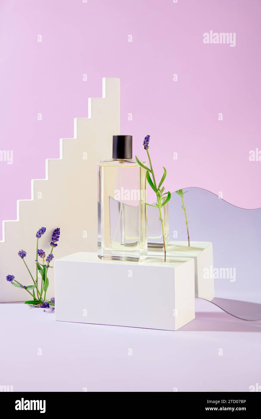 A perfume bottle on a white podium, mirrored reflection, and lavender ...