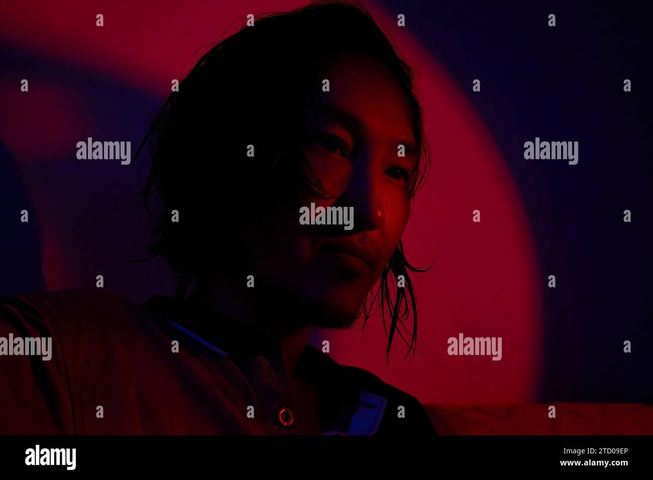 asian man in neon lighting Stock Photo