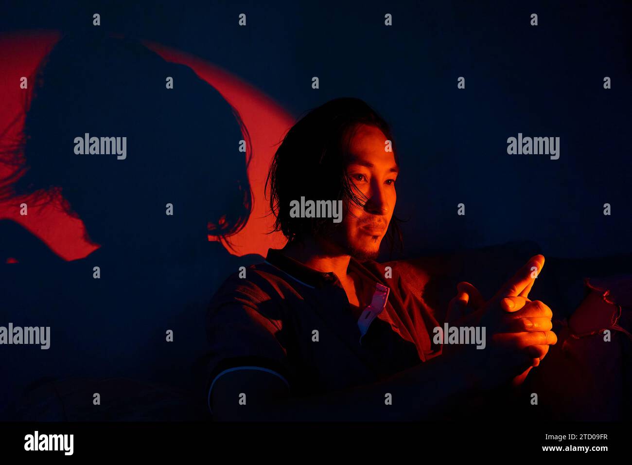 asian man in neon lighting Stock Photo