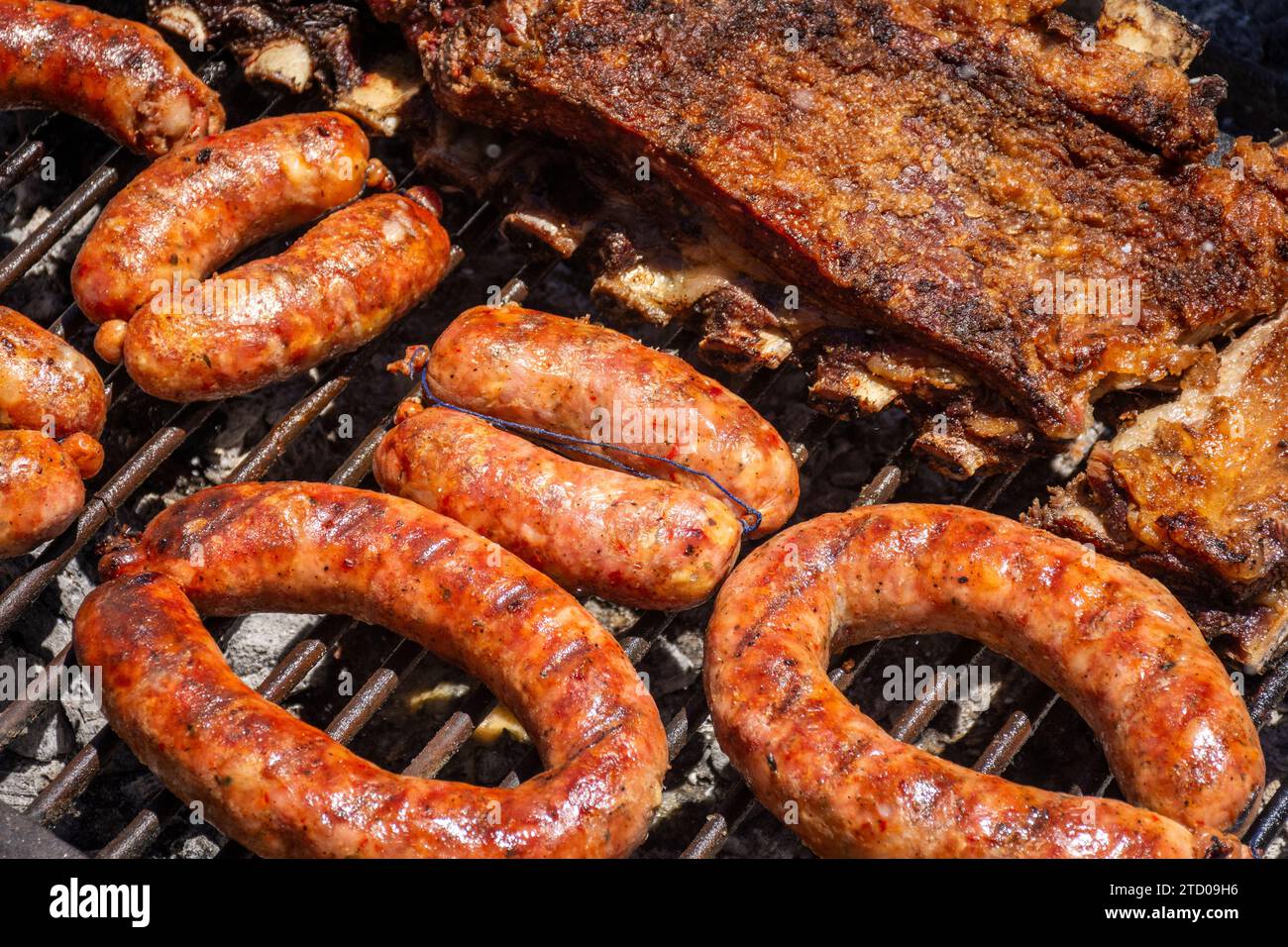 Typical gaucho barbecue with ribs and sausages in the countryside Stock Photo