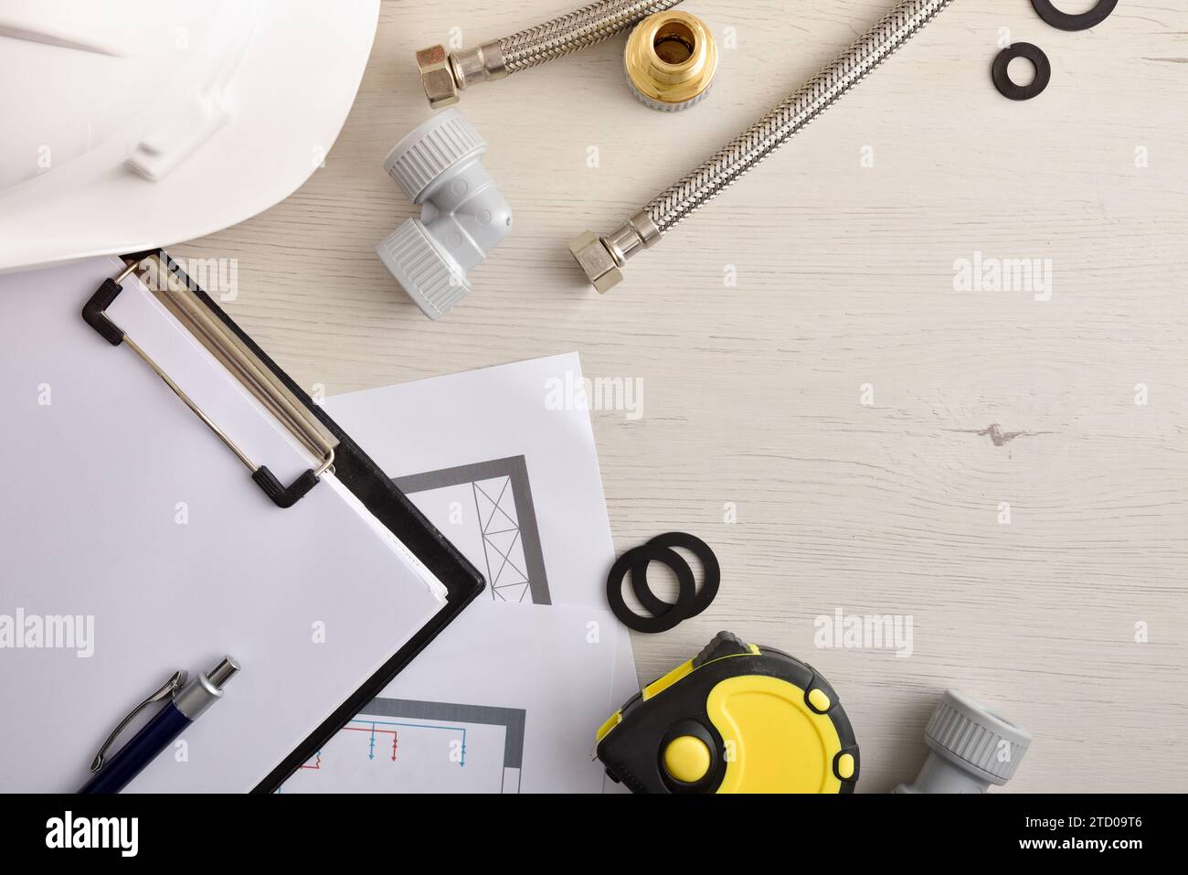 Concept of review of water installation elements in homes with flat notepad and water installation accessories. Top view. Horizontal composition. Stock Photo