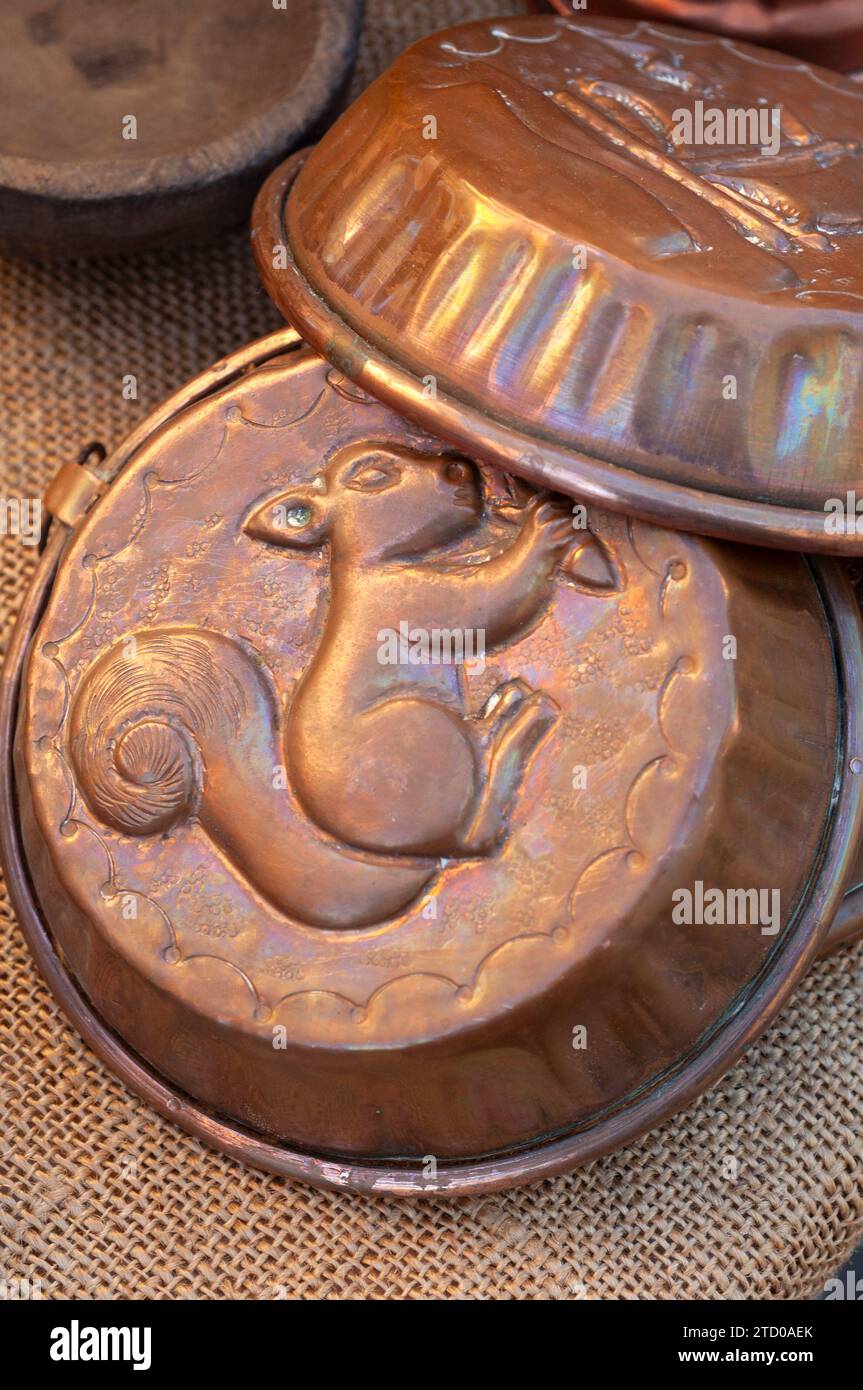 Italy, Lombardy, Flea Market, Old Copper Pudding Molds Decorated with a Squirrel Stock Photo