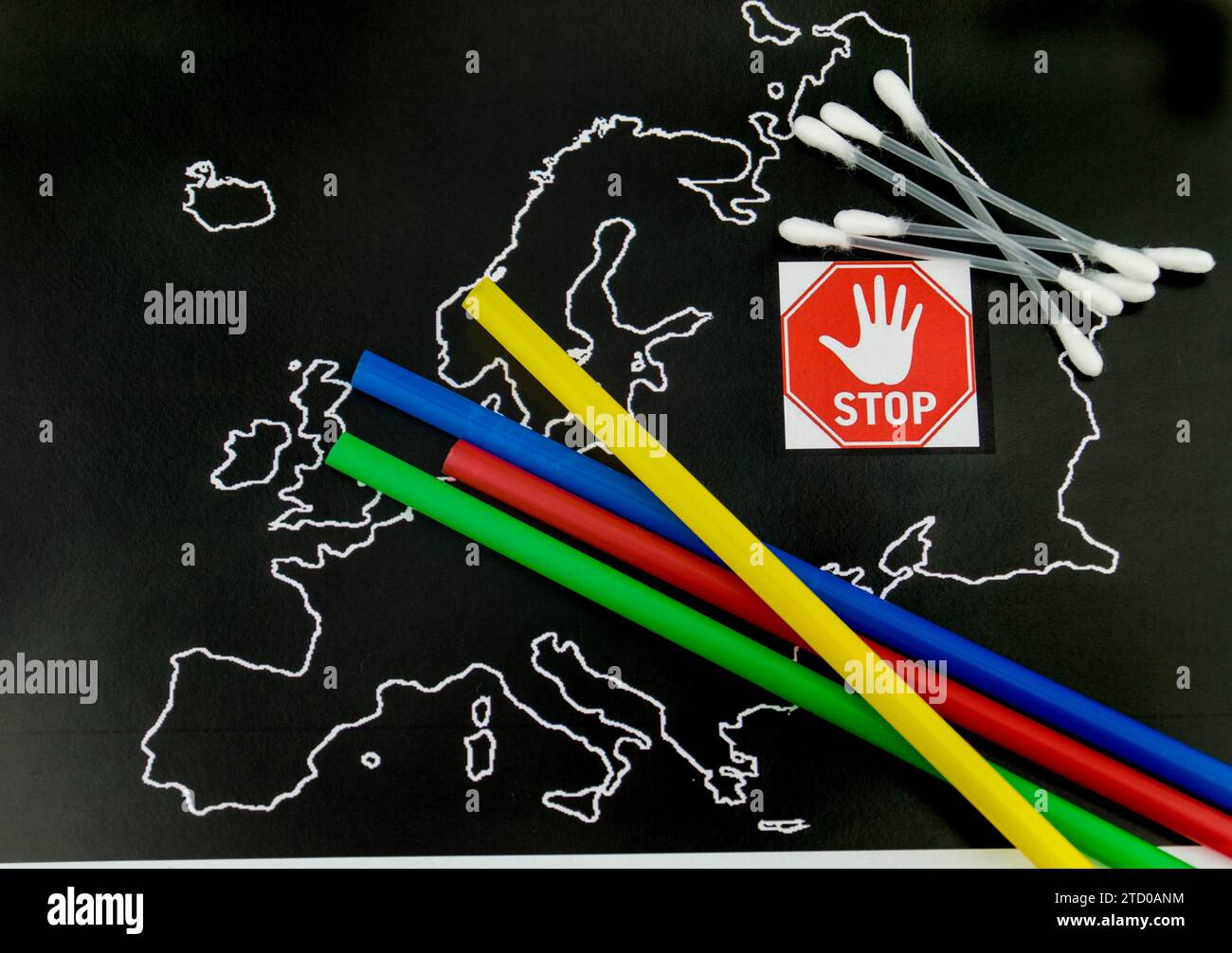 Plastic straws and cotton buds on a map of Europe with a stop sign, ban ...