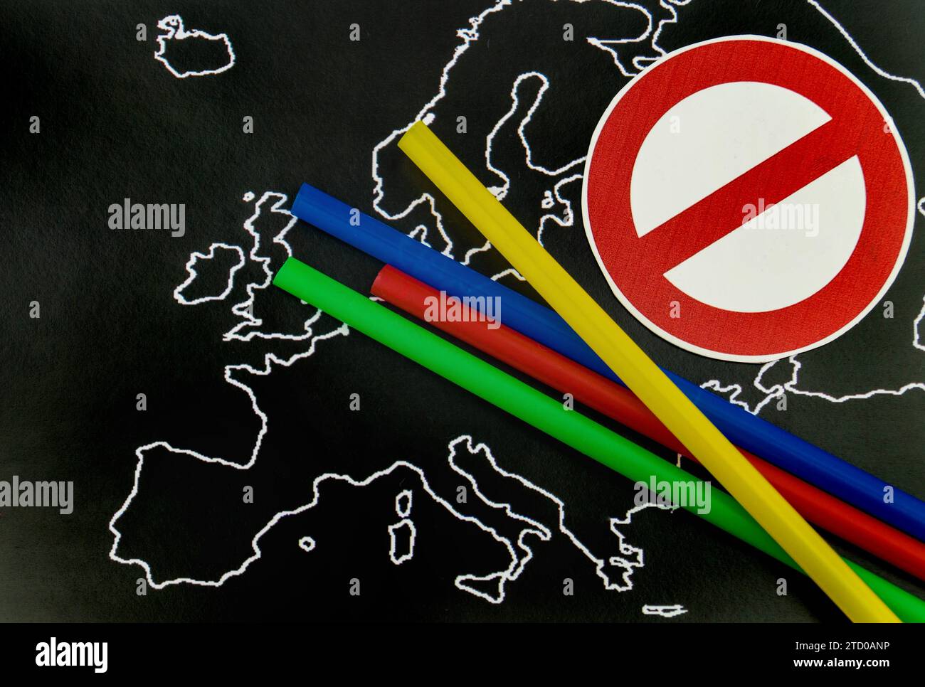 Plastic straws on map of Europe with prohibition sign, ban on plastic