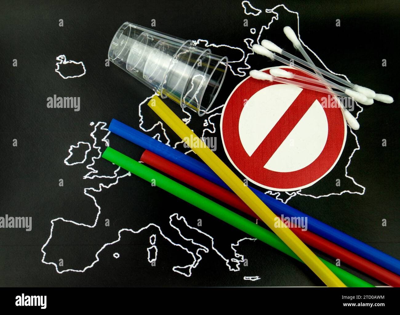 Plastic straws, cups and cotton buds on a map of Europe with a