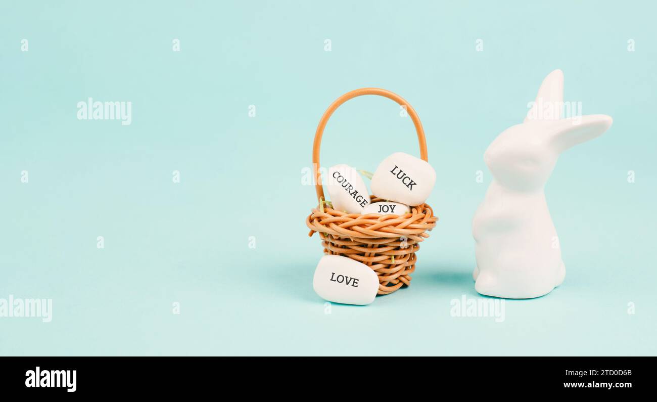 Easter bunny or rabbit with wicker basket, words like love, luck, joy