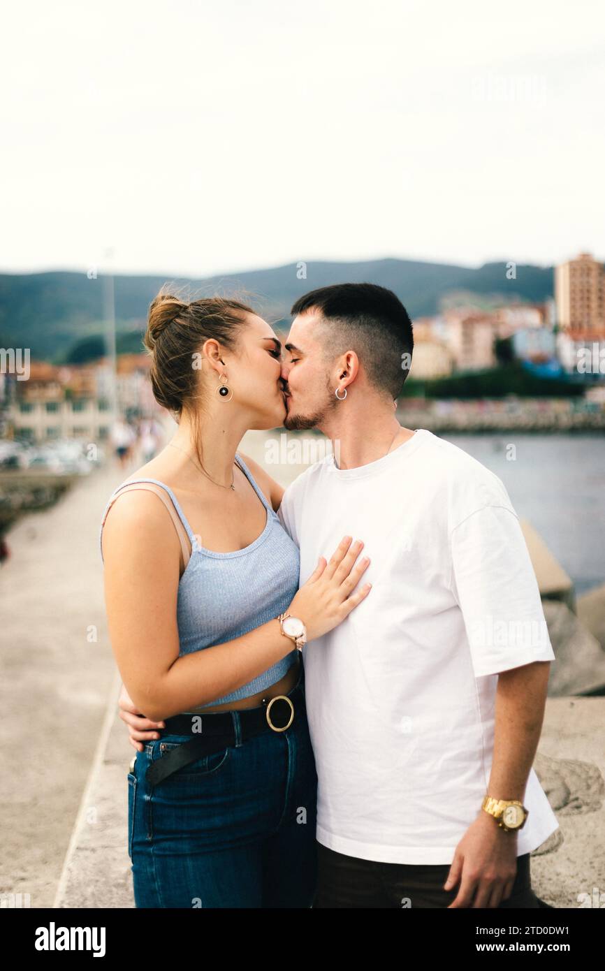 Young couple hugging riverside hi-res stock photography and images - Alamy