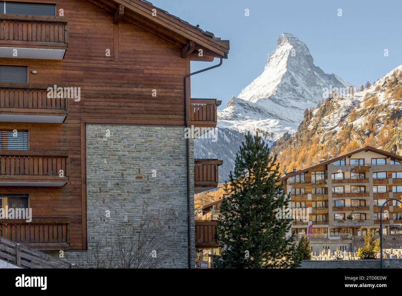 A serene view of Zermatt village showcasing chalet-style buildings with ...