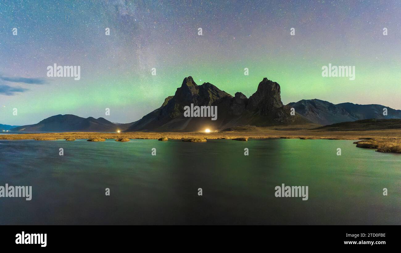 A breathtaking view of the northern lights weaving across a starlit sky