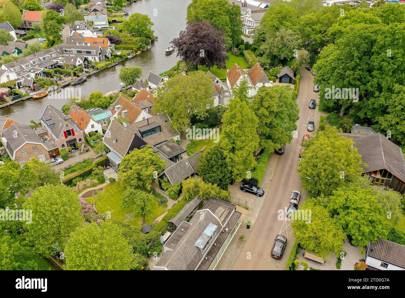 Aerial view houses surrounded lush hi-res stock photography and images ...