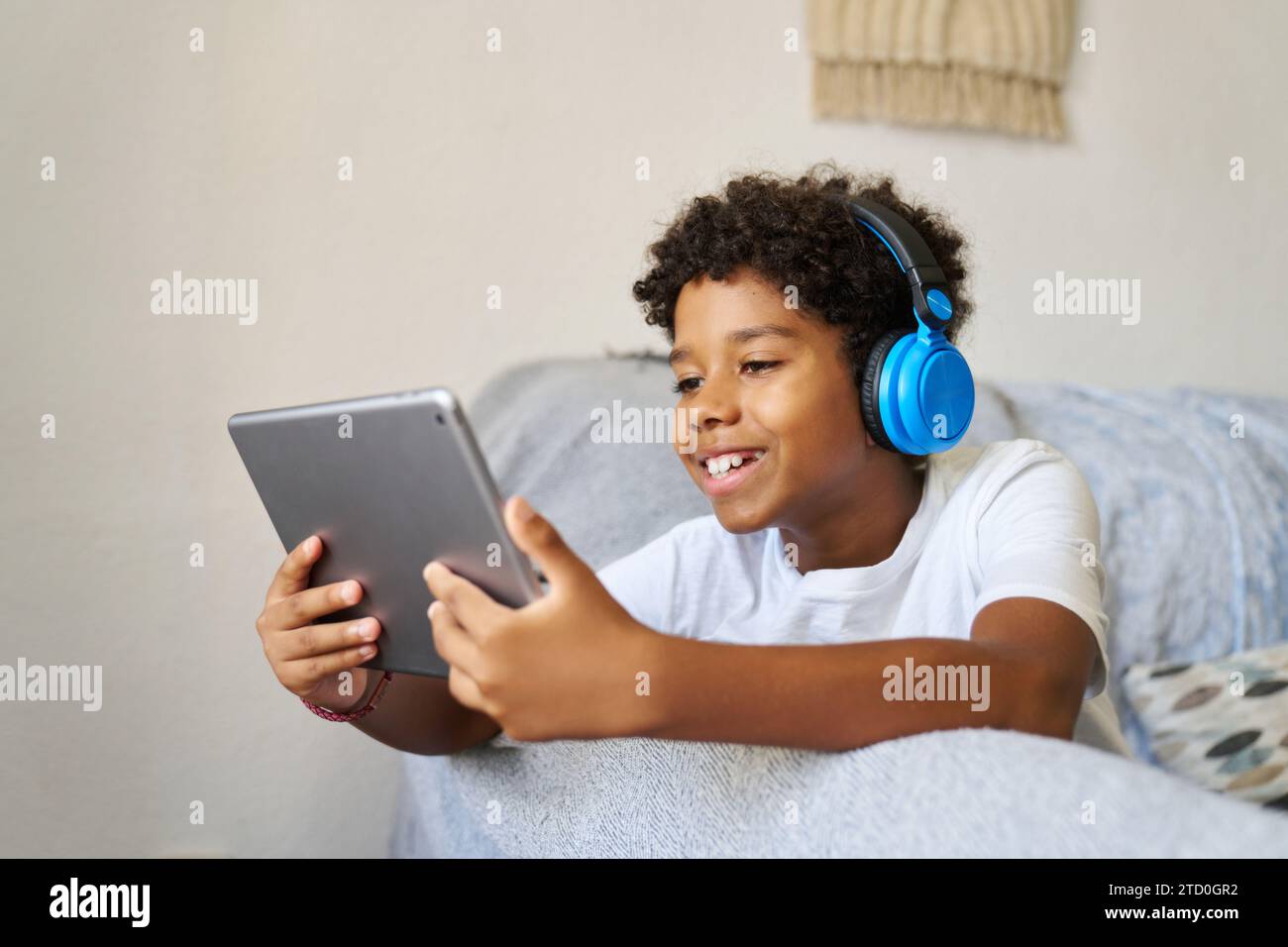 Teen boy relaxing sofa african hi-res stock photography and images - Alamy
