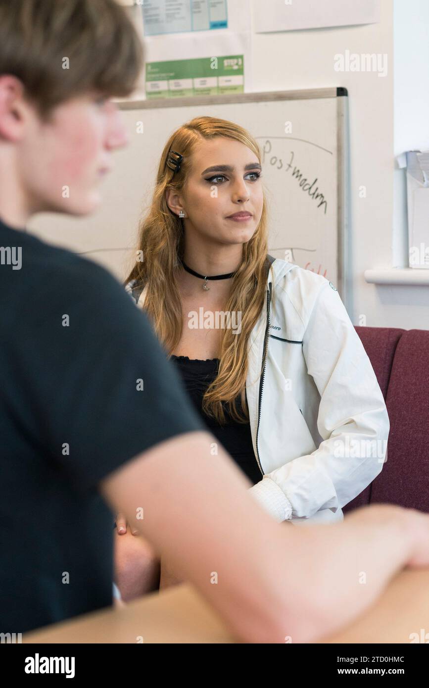 A Level students talk to an adult mentor at their college who is counselling them. Stock Photo