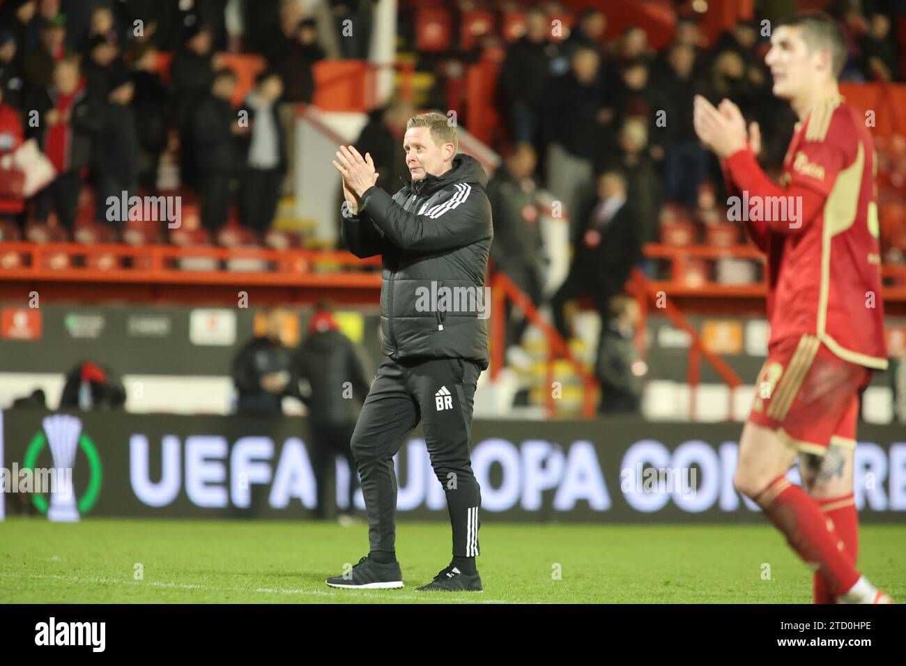 ABERDEEN, SCOTLAND - DECEMBER 14: Full time Aberdeen manager Barry Robson celebrates his sides victory during the Aberdeen FC v Eintracht Frankfurt Group G-UEFA Europa Conference League match at Pittodrie Stadium on December 14, 2023 in Aberdeen, Scotland. (MB Media) Stock Photo