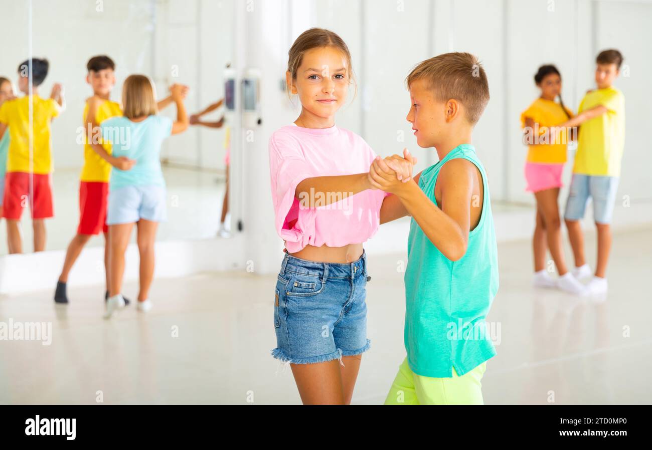 Portrait of children enjoying of partner dance in class Stock Photo - Alamy