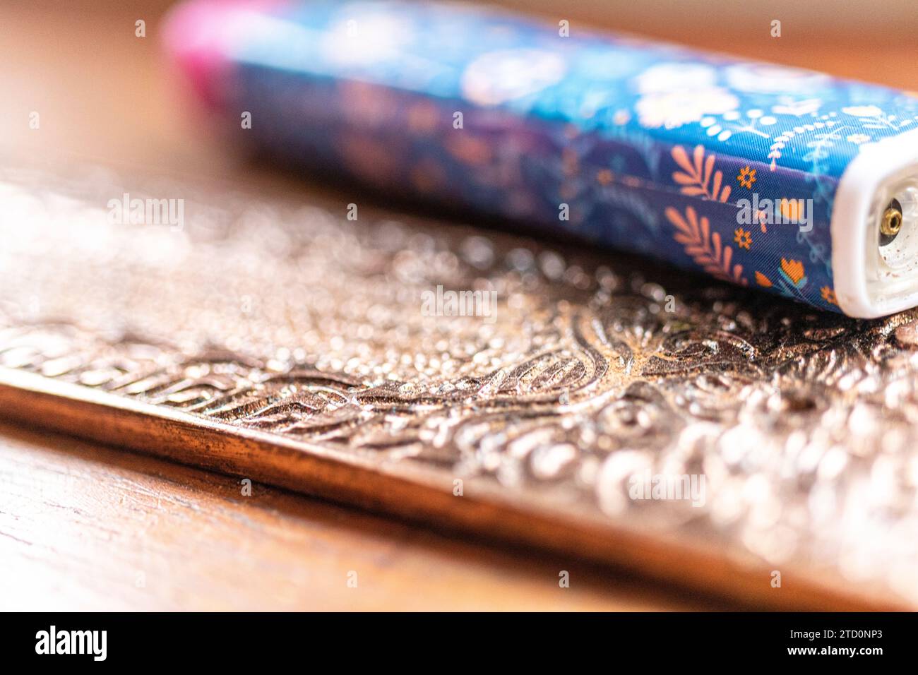 Close-up macro shot of a beautifully intricate pattern relief on an incense burner Stock Photo
